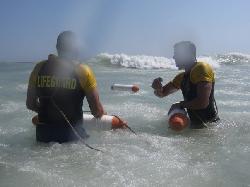 Lifeguards just complete an ocean rescue.